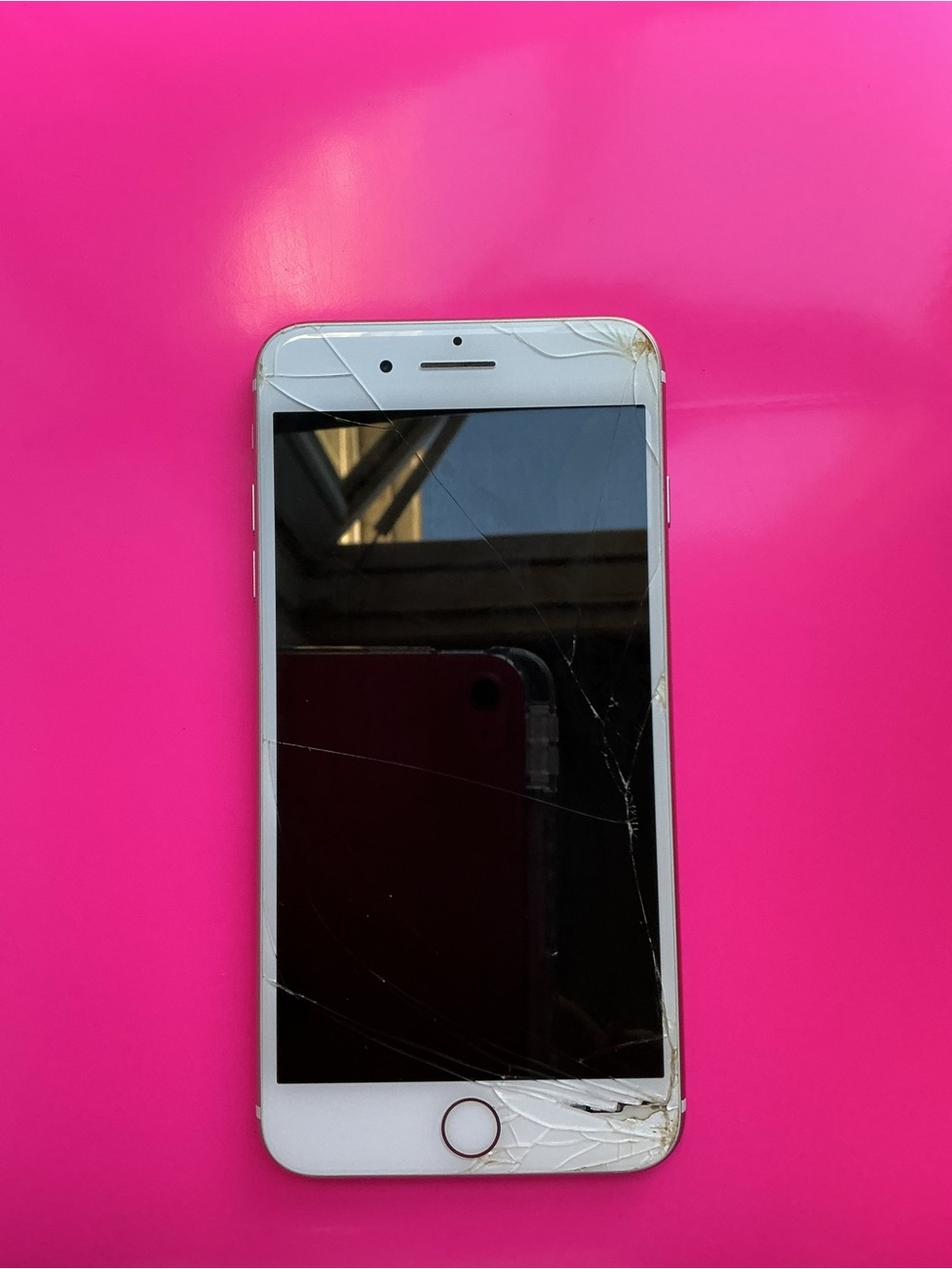 Apple White iPhone with Cracked Front Glass